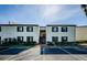 Condominium exterior featuring a landscaped courtyard and second story access stairs at 722 116Th Ave N # 2002, St Petersburg, FL 33716