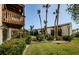 Exterior view of condo buildings surrounded by lush landscaping and palm trees at 722 116Th Ave N # 2002, St Petersburg, FL 33716