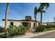 Exterior of building with stone chimney, lush landscaping, and a private entrance at 722 116Th Ave N # 2002, St Petersburg, FL 33716