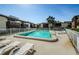 Community pool surrounded by lounge chairs and condo buildings at 722 116Th Ave N # 2002, St Petersburg, FL 33716