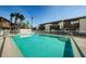 Community pool offering clear blue water and views of neighboring condo buildings at 722 116Th Ave N # 2002, St Petersburg, FL 33716