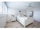 Bright bedroom with white furniture, shuttered windows, and wood-look floors at 7465 Bay Island S Dr # 318, South Pasadena, FL 33707