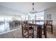 Dining area featuring a wood table, bar stools, and a mirrored wall to the left at 7465 Bay Island S Dr # 318, South Pasadena, FL 33707