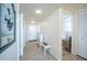 Bright hallway with tile flooring and coastal decorations providing access to the bedrooms at 7465 Bay Island S Dr # 318, South Pasadena, FL 33707