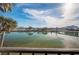 Serene water view from the property, featuring calm water reflecting the clear, blue sky at 7465 Bay Island S Dr # 318, South Pasadena, FL 33707