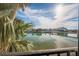 Beautiful water view from the property, showcasing clear water and lush palm trees at 7465 Bay Island S Dr # 318, South Pasadena, FL 33707