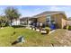 Backyard featuring a paver patio and screened in porch at 8208 Harwich Port Ln, Gibsonton, FL 33534