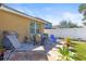 Backyard patio with a table, grill and chairs on a brick paver patio at 8208 Harwich Port Ln, Gibsonton, FL 33534