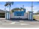 Elegant community entrance sign with stone accents and lush landscaping welcoming residents at 8208 Harwich Port Ln, Gibsonton, FL 33534