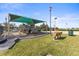 Community playground featuring a covered play structure, benches, and a safe play surface at 8208 Harwich Port Ln, Gibsonton, FL 33534