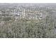 An aerial view of a neighborhood featuring many single Gathering homes near a wooded area at 8547 Horizon Ln, Hudson, FL 34667