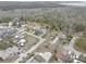 This aerial view shows the community layout and the proximity to the forest at 8547 Horizon Ln, Hudson, FL 34667