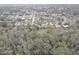 Aerial view of single Gathering homes in a quiet neighborhood near a nature preserve at 8547 Horizon Ln, Hudson, FL 34667