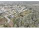 An aerial view of a residential area close to a heavily wooded area at 8547 Horizon Ln, Hudson, FL 34667