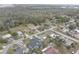 Aerial view of a residential neighborhood surrounded by lush trees at 8547 Horizon Ln, Hudson, FL 34667