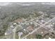 Aerial view of homes with pools and yards in a tranquil neighborhood setting at 8547 Horizon Ln, Hudson, FL 34667