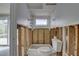 Renovated bathroom featuring a toilet and a window overlooking the pool at 8547 Horizon Ln, Hudson, FL 34667