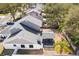 Aerial view of a well-maintained house with a spacious backyard and covered patio at 8814 Hampden Dr, Tampa, FL 33626