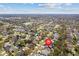 Scenic aerial view of a neighborhood with tree-lined streets, indicating the location of a home with a red marker at 8814 Hampden Dr, Tampa, FL 33626