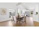 Bright dining area with modern lighting and a view into the well-lit kitchen at 8814 Hampden Dr, Tampa, FL 33626