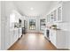 Bright kitchen with stainless steel appliances, subway tile backsplash, and white cabinets at 8814 Hampden Dr, Tampa, FL 33626