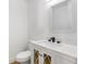 A powder room features modern fixtures and a decorative vanity cabinet at 8814 Hampden Dr, Tampa, FL 33626