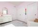 Cozy Bedroom with pink walls, white furniture, and a decorative rug at 9258 Rock Harbour Way, Tampa, FL 33637