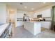 Bright kitchen with white cabinetry, granite countertops, stainless steel appliances, and tile flooring at 9258 Rock Harbour Way, Tampa, FL 33637