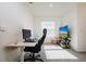 Bright and airy home office space with large window and modern furnishings at 9258 Rock Harbour Way, Tampa, FL 33637