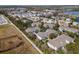 An elevated view of a neighborhood showcasing neat landscaping, community ponds, and residential architecture at 9510 Georgian Park Ln # 106, Tampa, FL 33626