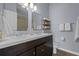 Bathroom featuring a double sink vanity with modern fixtures and plenty of storage space at 9510 Georgian Park Ln # 106, Tampa, FL 33626