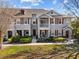 Beautiful two-story townhome featuring red shutters and a charming front entrance at 9510 Georgian Park Ln # 106, Tampa, FL 33626