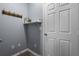 Practical mudroom with utility shelf and coat hooks, ideal for organization near the back door at 9510 Georgian Park Ln # 106, Tampa, FL 33626