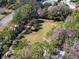 Aerial view of a beautiful community park featuring a picnic shelter and lush landscaping at 9510 Georgian Park Ln # 106, Tampa, FL 33626