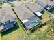 Aerial perspective highlights the lovely pool, backyard privacy, and expansive grassy yard at 10132 Tuscan Sun Ave, Riverview, FL 33578