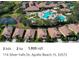 Aerial view of single-Gathering homes, pond, lush landscaping and community pool in Apollo Beach, FL at 116 Silver Falls Dr, Apollo Beach, FL 33572