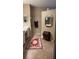 Bright bathroom featuring double vanity, octagon mirror and tile floors with red patterned rug at 116 Silver Falls Dr, Apollo Beach, FL 33572