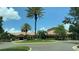 Community clubhouse with lush tropical landscaping, sidewalks, and ample parking at 116 Silver Falls Dr, Apollo Beach, FL 33572