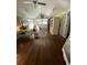 Bright living room with wood floors, light walls and white-washed ceiling at 12 Braden Castle Dr, Bradenton, FL 34208