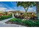 Beautifully landscaped entrance to the clubhouse, offering a welcoming and serene environment at 1227 Queen Anne Dr # C, Palm Harbor, FL 34684