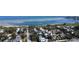 Aerial view of a residential neighborhood near the water, showcasing tree-lined streets and diverse homes at 123 17Th Se Ave, St Petersburg, FL 33701