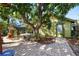 Cozy backyard nook with brick-paved area, table, seating, and greenery providing a tranquil outdoor retreat at 123 17Th Se Ave, St Petersburg, FL 33701