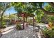 Serene backyard patio featuring a pergola, comfortable seating, brick paving, and vibrant greenery at 123 17Th Se Ave, St Petersburg, FL 33701