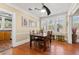 Inviting dining room with hardwood floors, bright windows, and a stylish ceiling fan at 123 17Th Se Ave, St Petersburg, FL 33701