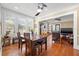 Dining area with hardwood floors, natural light, and modern ceiling fan at 123 17Th Se Ave, St Petersburg, FL 33701