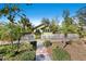 Wide shot of house showing manicured lawn and a hexagon tiled walkway leading to the front gate at 123 17Th Se Ave, St Petersburg, FL 33701