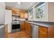 Well-lit kitchen with stainless steel appliances, including a dishwasher and gas range at 123 17Th Se Ave, St Petersburg, FL 33701