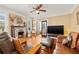 Living room with hardwood floors, leather furniture and a fireplace at 123 17Th Se Ave, St Petersburg, FL 33701