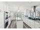 Stylish kitchen featuring an island, granite countertops, and a water view at 1514 Sea Gull S Dr, St Petersburg, FL 33707