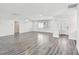 Bright and airy living room with wood look tile floors and ample space for entertaining at 1514 Sea Gull S Dr, St Petersburg, FL 33707